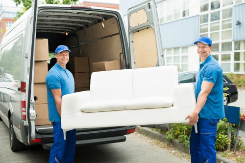 Removal van and movers in a Westminster street with central London properties