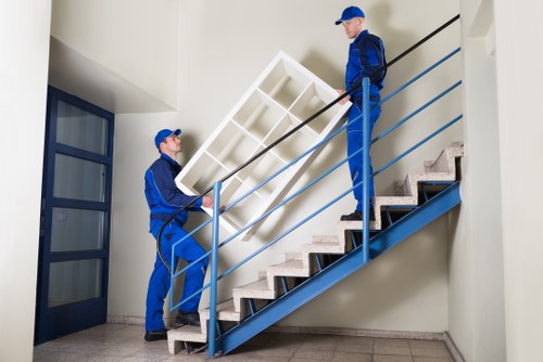 Professional movers handling furniture in a Westminster property