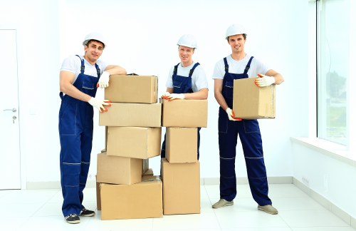 Loading boxes into a Westminster moving truck with care