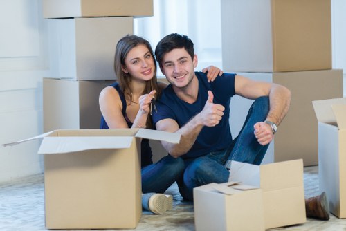 Careful loading of household items for a move in Westminster
