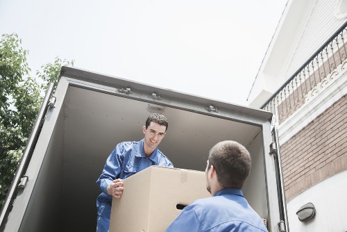 Team using safe manual handling techniques during a removal service