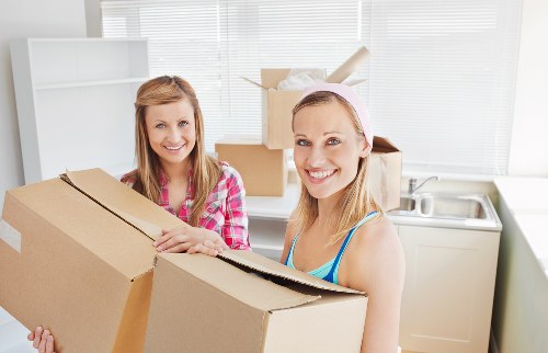 Packed boxes and furniture ready for removals in Westminster apartment